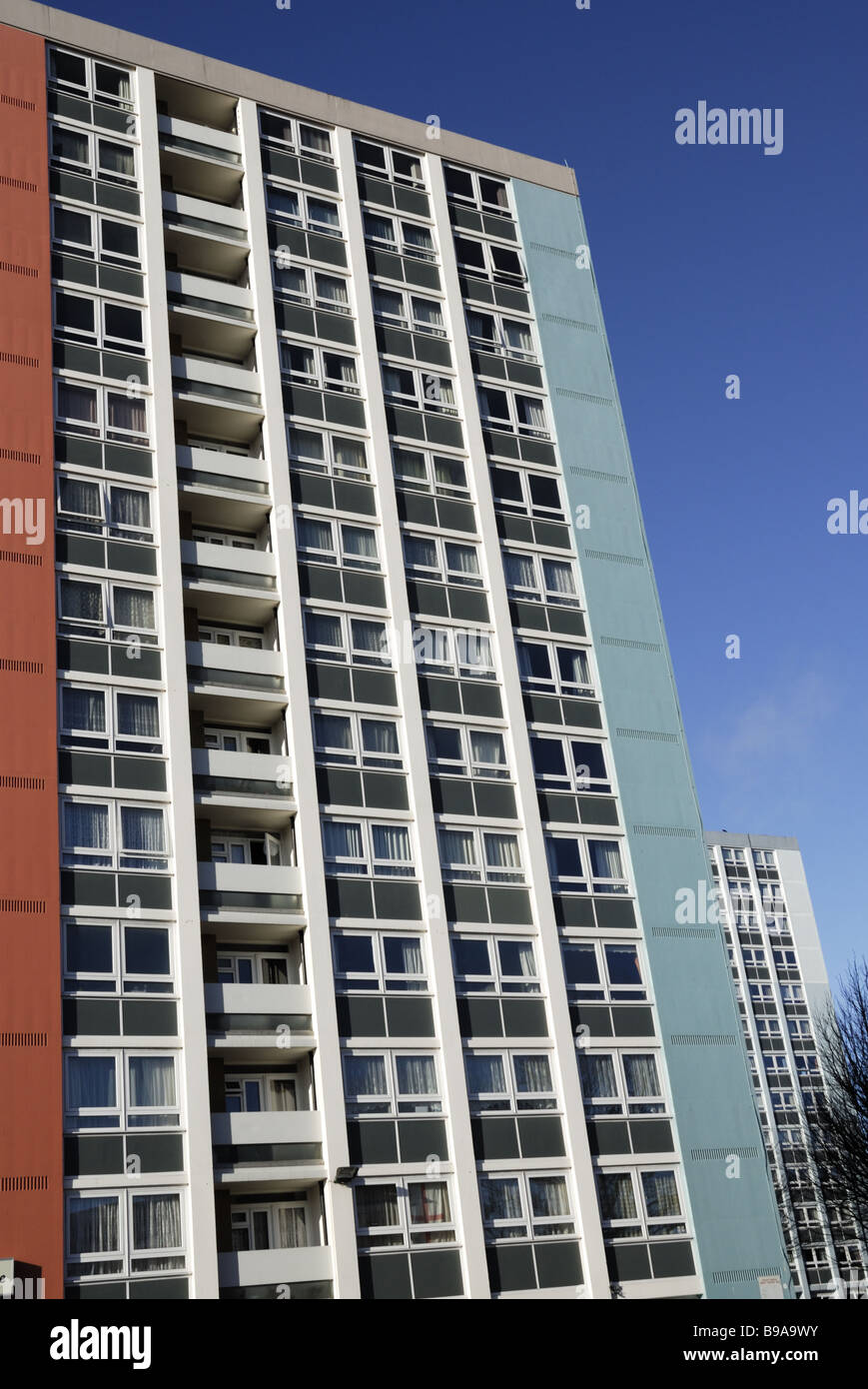 A 1960`s block of flats viewed at angle with blue sky Stock Photo